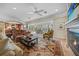 Spacious living room with fireplace, high ceilings, and views to the pool and patio at 28 Colony Point Dr, Punta Gorda, FL 33950