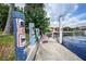 Fun dock area with painted posts and pink chairs at 28 Colony Point Dr, Punta Gorda, FL 33950