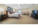 Spacious Primary bedroom with king-size bed and sitting area at 28 Colony Point Dr, Punta Gorda, FL 33950