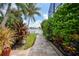 Landscaped brick pathway leading to the waterfront at 28 Colony Point Dr, Punta Gorda, FL 33950