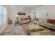 Comfortable sitting area with patterned sofas at 28 Colony Point Dr, Punta Gorda, FL 33950