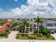 Two-story home with a large driveway and tropical landscaping at 28 Colony Point Dr, Punta Gorda, FL 33950