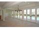 Spacious dining room with pool access and chandelier at 28 Colony Point Dr, Punta Gorda, FL 33950
