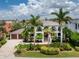 Luxury waterfront home with a large yard and beautiful landscaping at 28 Colony Point Dr, Punta Gorda, FL 33950