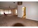 Spacious living room with carpeted floors and a view of the kitchen at 1565 Dorchester St, Port Charlotte, FL 33952
