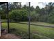 View from screened porch showcasing backyard greenery at 1565 Dorchester St, Port Charlotte, FL 33952