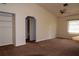 Open living area with a built-in shelving unit and carpeted floors at 1565 Dorchester St, Port Charlotte, FL 33952