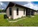 House exterior showcasing side yard landscaping at 1565 Dorchester St, Port Charlotte, FL 33952
