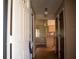 Bright entryway with wood floors and views into the living and kitchen areas at 1565 Dorchester St, Port Charlotte, FL 33952