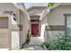 Inviting house entrance with red door and landscaped walkway at 10331 Celtic Ash Dr, Ruskin, FL 33573