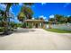 Small guest house with a basketball hoop and a paved driveway at 182 Monica St, Port Charlotte, FL 33954