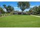 One-story house with landscaping and driveway at 182 Monica St, Port Charlotte, FL 33954