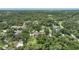 Residential area with single Gathering homes, lush greenery, and mature trees at 182 Monica St, Port Charlotte, FL 33954
