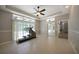 Sunlit exercise room with sliding glass doors and tile floors at 182 Monica St, Port Charlotte, FL 33954