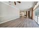 Bright and airy Gathering room with wood-look floors and sliding glass doors at 182 Monica St, Port Charlotte, FL 33954