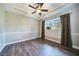 Spacious bedroom with wood flooring and a ceiling fan at 182 Monica St, Port Charlotte, FL 33954
