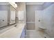 Bathroom with a large vanity, walk-in shower, and tiled floor at 182 Monica St, Port Charlotte, FL 33954