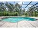 Inviting pool and spa with screened enclosure at 182 Monica St, Port Charlotte, FL 33954