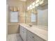 Bathroom with vanity, large mirror, and shower at 182 Monica St, Port Charlotte, FL 33954
