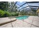 Inviting pool and spa with screened enclosure at 182 Monica St, Port Charlotte, FL 33954