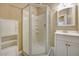 Bathroom with corner shower, vanity, and storage cabinet at 182 Monica St, Port Charlotte, FL 33954
