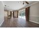Gathering room with fireplace, pool view, and wood-look floors at 182 Monica St, Port Charlotte, FL 33954