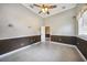 Bright bedroom with tile floors and door to hallway at 182 Monica St, Port Charlotte, FL 33954