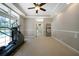 Bright home gym with exercise equipment and view of the pool at 182 Monica St, Port Charlotte, FL 33954