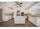 Bright kitchen featuring an island, stainless steel appliances, and white cabinetry at 182 Monica St, Port Charlotte, FL 33954