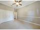 Spacious bedroom with double door closet and ceiling fan at 182 Monica St, Port Charlotte, FL 33954