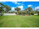 Spacious backyard with pool and lush landscaping at 182 Monica St, Port Charlotte, FL 33954
