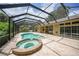 Relaxing pool and spa area with screened enclosure at 182 Monica St, Port Charlotte, FL 33954