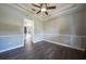 Light and airy bedroom with wood flooring and ceiling fan at 182 Monica St, Port Charlotte, FL 33954