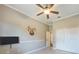 Charming bedroom with a ceiling fan, wood floors, and large closet at 182 Monica St, Port Charlotte, FL 33954