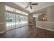 Gathering room with fireplace, pool view, and wood-look floors at 182 Monica St, Port Charlotte, FL 33954