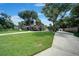 One story house with a large backyard and a long driveway at 182 Monica St, Port Charlotte, FL 33954