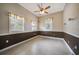 Spacious bedroom with tile floors and ceiling fan at 182 Monica St, Port Charlotte, FL 33954