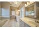 Bathroom with double vanity, soaking tub, and separate shower at 182 Monica St, Port Charlotte, FL 33954