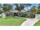 One-story house with landscaping and driveway at 182 Monica St, Port Charlotte, FL 33954