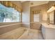 Bathroom features a relaxing soaking tub and a window at 182 Monica St, Port Charlotte, FL 33954