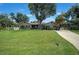 One-story house with landscaping and driveway at 182 Monica St, Port Charlotte, FL 33954