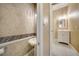 Small bathroom with pedestal sink and shower stall at 182 Monica St, Port Charlotte, FL 33954
