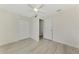 Spacious bedroom with double door closet and light wood-look floors at 6701 Elmwood Rd, North Port, FL 34287