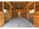 Interior of a barn with wooden stalls at 15300 Water Oak Ct, Punta Gorda, FL 33982