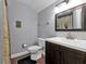 Clean bathroom with a vanity, toilet and shower/tub combo at 15300 Water Oak Ct, Punta Gorda, FL 33982