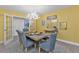 Dining room with a large wooden table and antler chandelier at 15300 Water Oak Ct, Punta Gorda, FL 33982