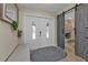 Entryway with white double doors and barn door at 15300 Water Oak Ct, Punta Gorda, FL 33982