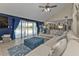 Relaxing living room with sectional sofa and sliding doors leading to the pool area at 15300 Water Oak Ct, Punta Gorda, FL 33982