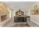 Home office with large desk and stone fireplace at 15300 Water Oak Ct, Punta Gorda, FL 33982