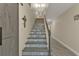 Stylish staircase with patterned tile and modern design at 15300 Water Oak Ct, Punta Gorda, FL 33982